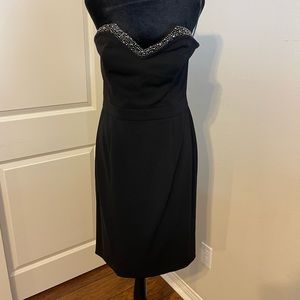 Black Midi strapless dress with rhinestone and crystal detail.
